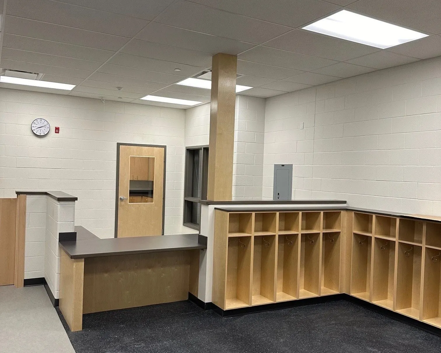 A finished reception counter with custom millwork and cubbies